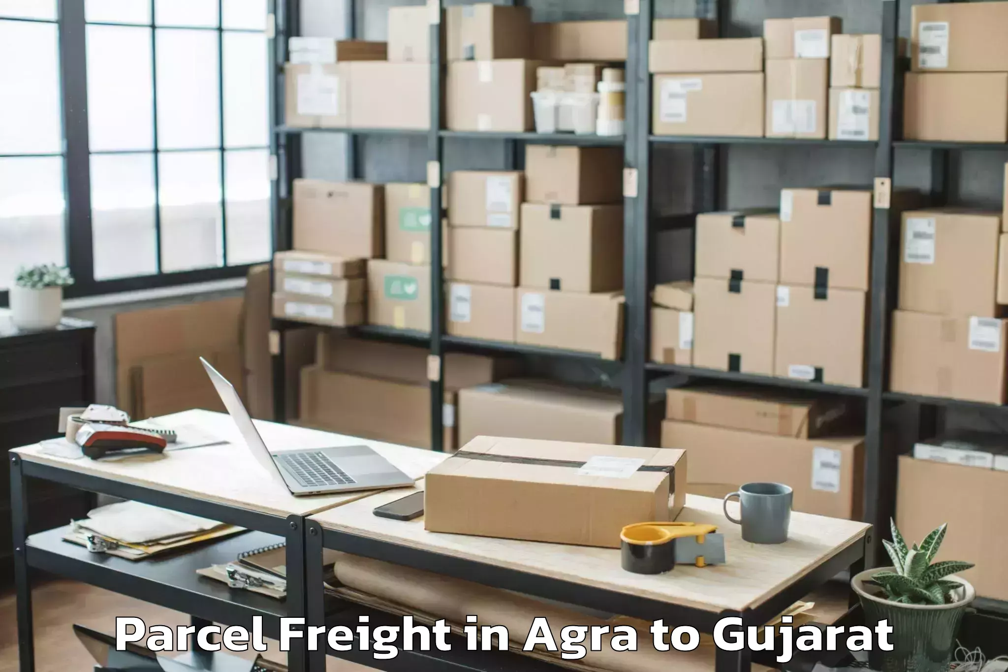 Top Agra to Gujarat Ayurved University Jam Parcel Freight Available